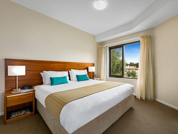 the interior of Quest Bendigo Central's one-bedroom apartment with a window