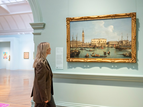 a woman admiring a painting at Bendigo Art Gallery