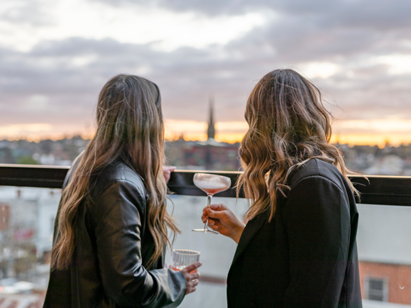 two women enjoying cocktails while admiring the view at Nimbus Rooftop, Bendigo