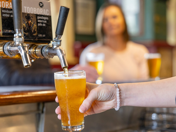 pouring tap beer into a glass at Tooborac Hotel & Brewery