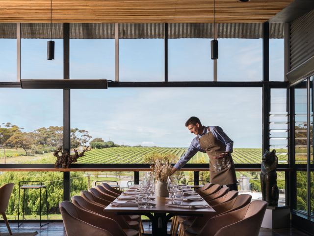 a waiter organising a table at Maxwell Restaurant, McLaren Vale