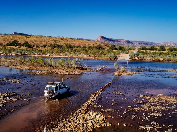 a 4WD crossing the Pentecost River