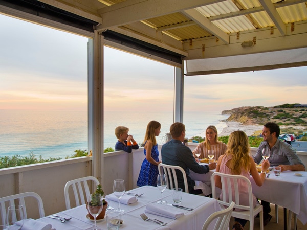 a family dining at a seaside restaurant