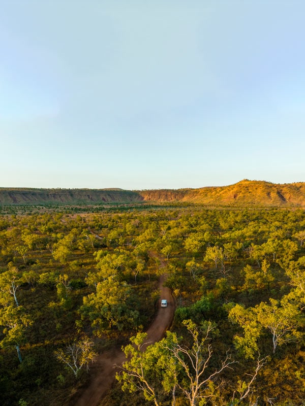 an aerial view of a car driving in El Questro Wilderness Park