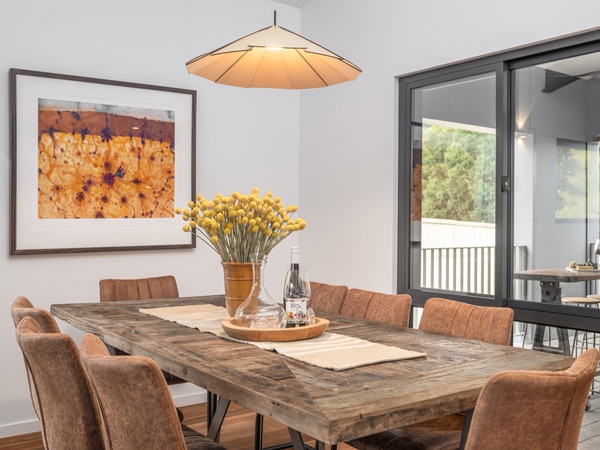 a sophisticated dining interior at Art House Townhouses