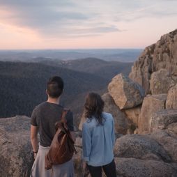 a couple standing atop Booroomba Rocks, Namadgi National Park
