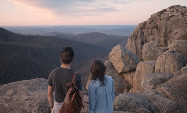 a couple standing atop Booroomba Rocks, Namadgi National Park