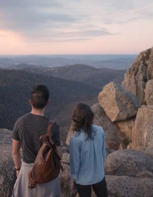 a couple standing atop Booroomba Rocks, Namadgi National Park