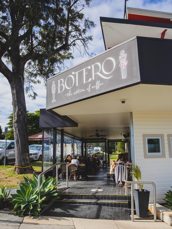 People enjoying food and drink at Botero Cafe, Maclean