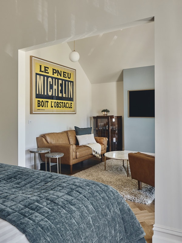 a bedroom with a cosy seating area at Bright Velo