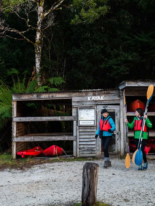 a mother and daughter getting kayak gears