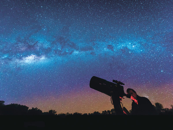 Astronomist looking at outback sky