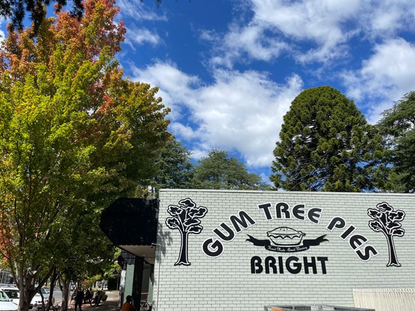 Gum Tree Pies cafe signage surrounded by trees in Bright
