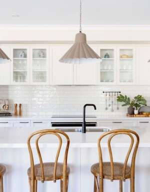 a modern kitchen interior with wooden chairs at Bridgewater