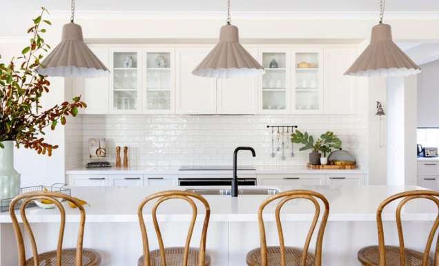a modern kitchen interior with wooden chairs at Bridgewater