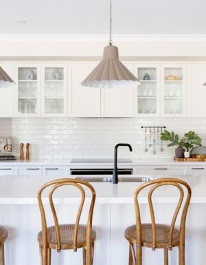 a modern kitchen interior with wooden chairs at Bridgewater