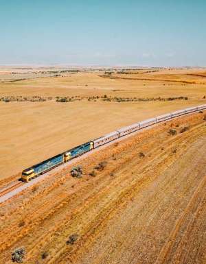 the Indian Pacific train traversing the vast and dry landscape of Clare Valley