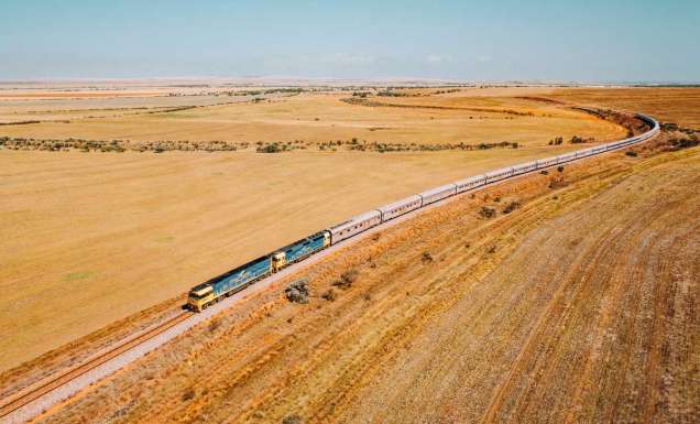 the Indian Pacific train traversing the vast and dry landscape of Clare Valley