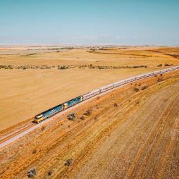 the Indian Pacific train traversing the vast and dry landscape of Clare Valley