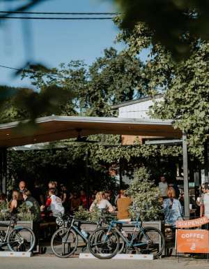 front view of Sixpence Coffee filled with customers