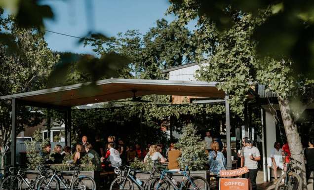 front view of Sixpence Coffee filled with customers