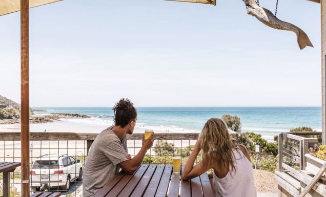 Couple having a schooner each at the Wye Beach Hotel on the Great Ocean Road
