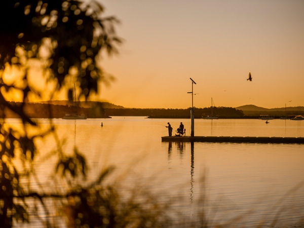 Fishermen enjoying a relaxing day by the Clarence River, Iluka