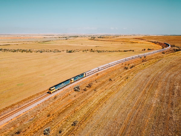 the Indian Pacific train traversing the vast dry landscape