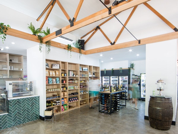 edible treats displayed on the shelves inside Punka Pantry cafe, Bright