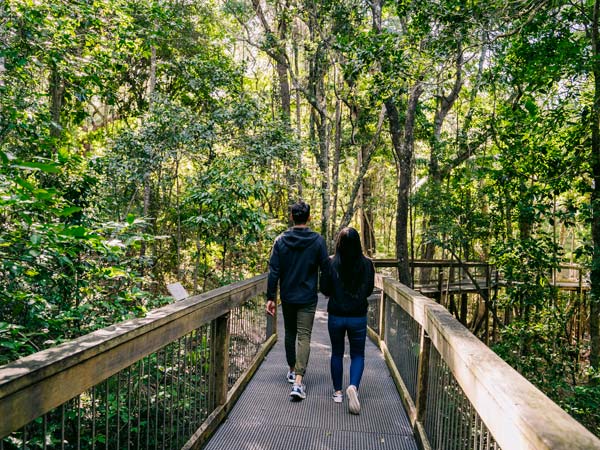 Couple enjoying a visit to the Sea Acres Rainforest Centre, Port