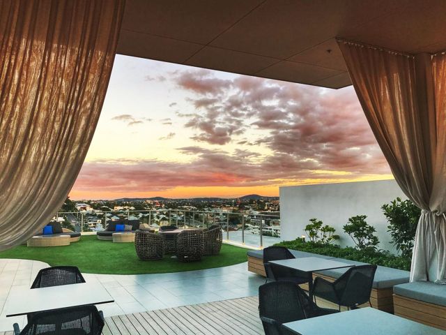 sunset views at the rooftop lounge of Alex Perry Hotel and Apartments, Brisbane