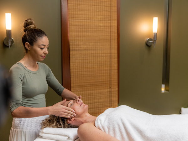 a woman having a facial massage at Gwinganna Lifestyle Resort, Gold Coast spas.