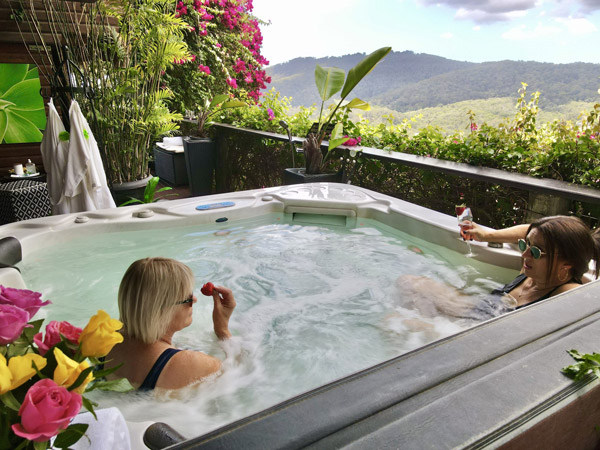 two women relaxing in a jacuzzi at On Eagle Wings Mountain Retreat & Spa, Gold Coast