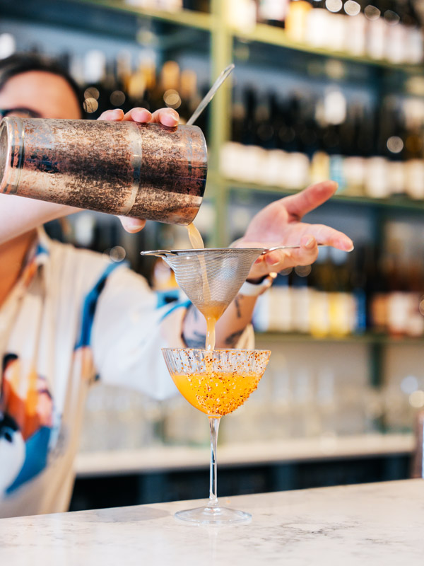 a bartender preparing a drink at Paloma wine bar, Gold Coast
