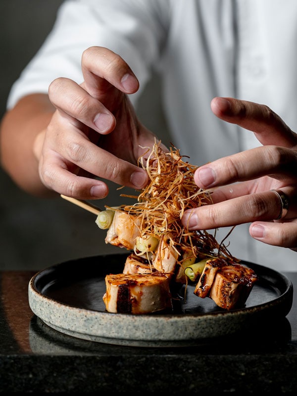 a chef preparing a Japanese dish at Kiyomi restaurant, Gold Coast