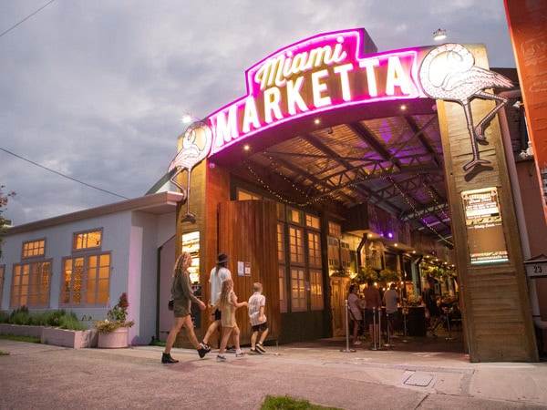 a family entering Miami Marketta