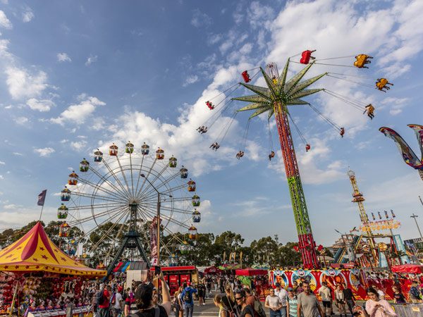 Crowds enjoying the carnival rides at the Sydney Royal Easter Show, Sydney Showground at Sydney Olympic Park.