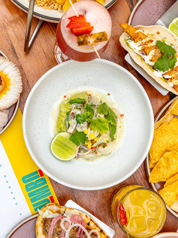 a table-top view of food and drinks at The Collective, Palm Beach