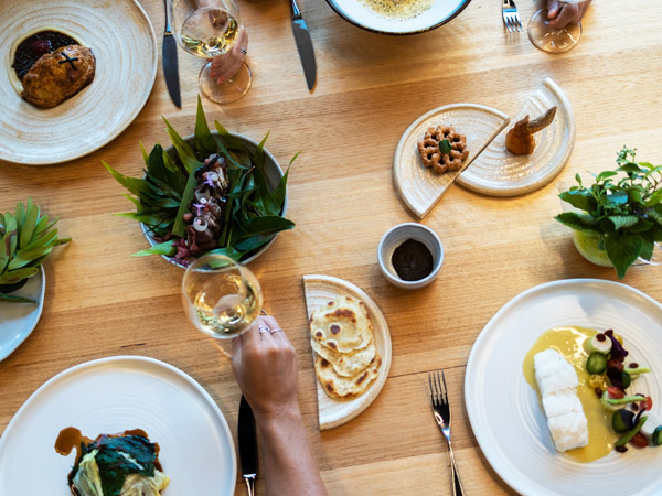 a spread of food and drinks on the table at Palette, best restaurants Gold Coast