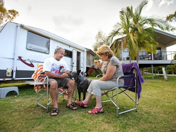 an old couple petting their dog at BIG4 Gold Coast Holiday Park