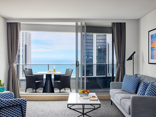 a cosy suite with balcony and beach views at Meriton Suites Broadbeach