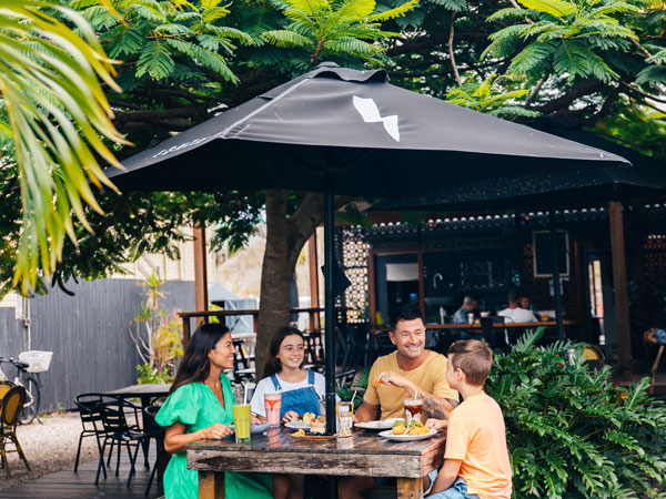 a family dining al fresco at Stone’s Throw, Gold Coast cafes