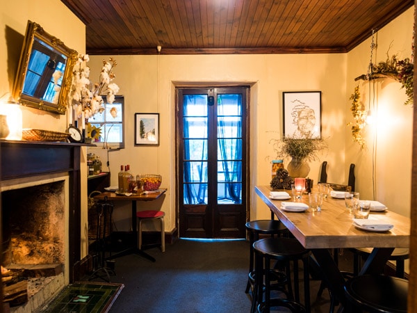 the interior of a a rustic cottage at Merrijig Inn