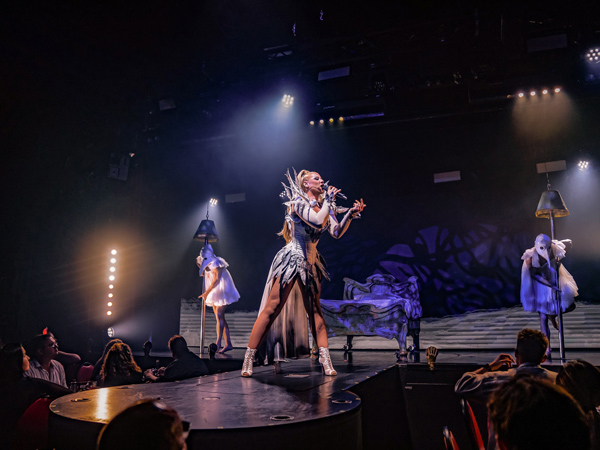 a woman singing on stage at Dracula's Cabaret and Burlesque Show, Gold Coast