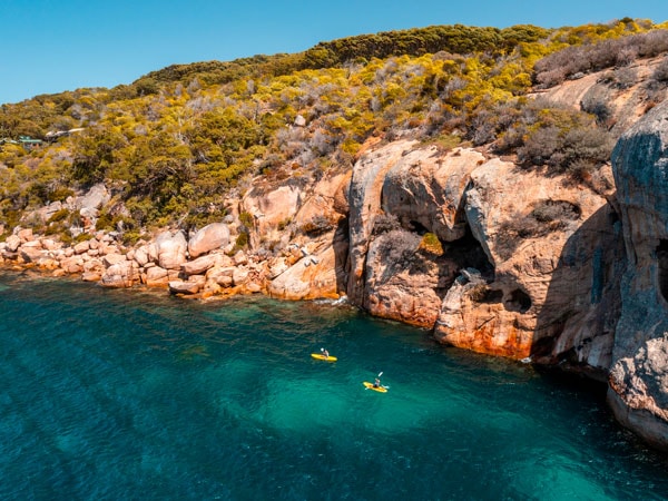 an aerial view of the ocean with rock formation at Esperance