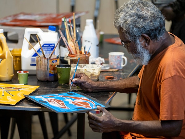 artist painting at Marrawuddi Arts & Culture