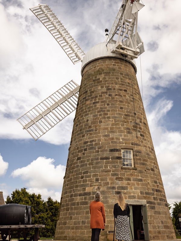 two people staring in awe at Australia’s third oldest windmill