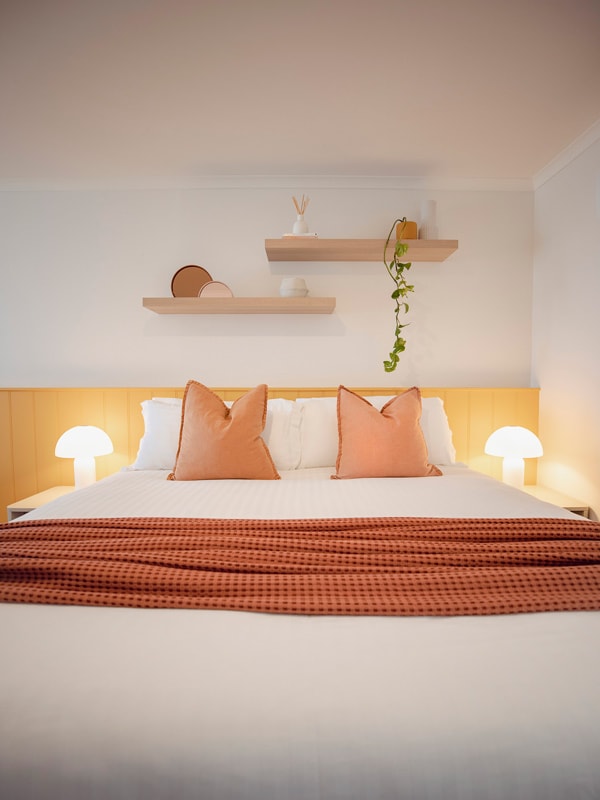 orange sheets and pillows at Sunnymead bedroom