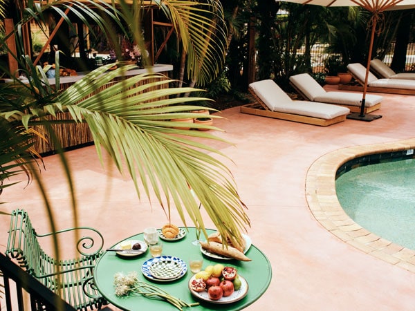 Pool and table with food on it at Sunseeker