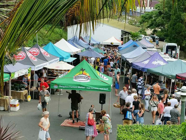people browsing through the stalls at Bangalow Farmers Market, Byron Bay
